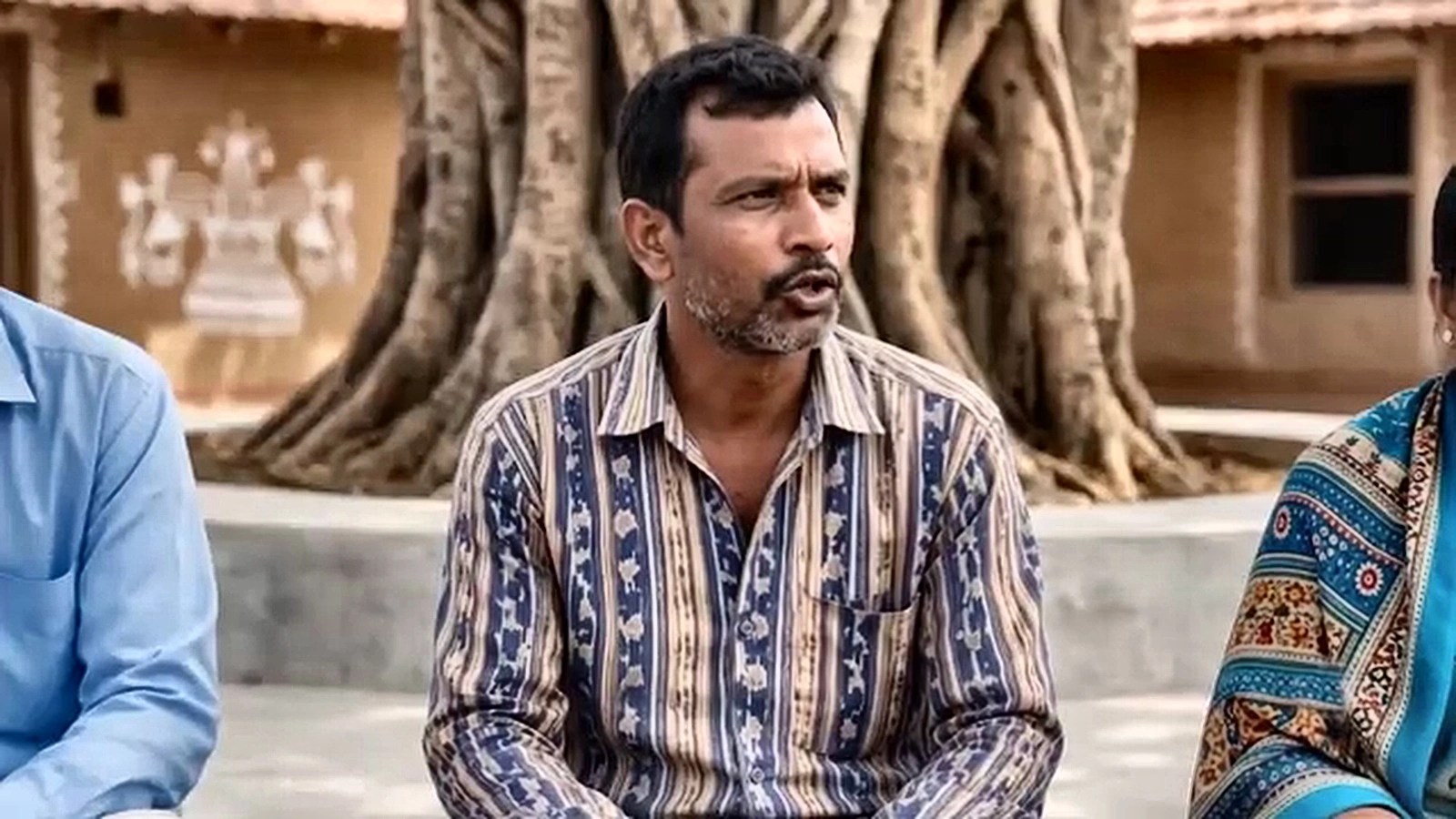 Shot 4 close-up of villager asking question (VOC)